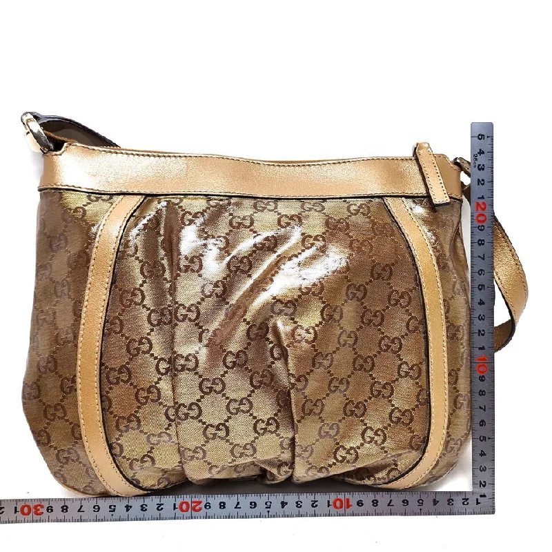 Gucci tote bags for women with a spacious interiorGucci Gold Coated Canvas Crossbody Bag