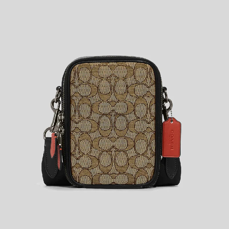 Coach Dempsey bags with a contrast - colored interior for visual interestCOACH Stanton Crossbody In Signature Jacquard Khaki/Black Multi CH097