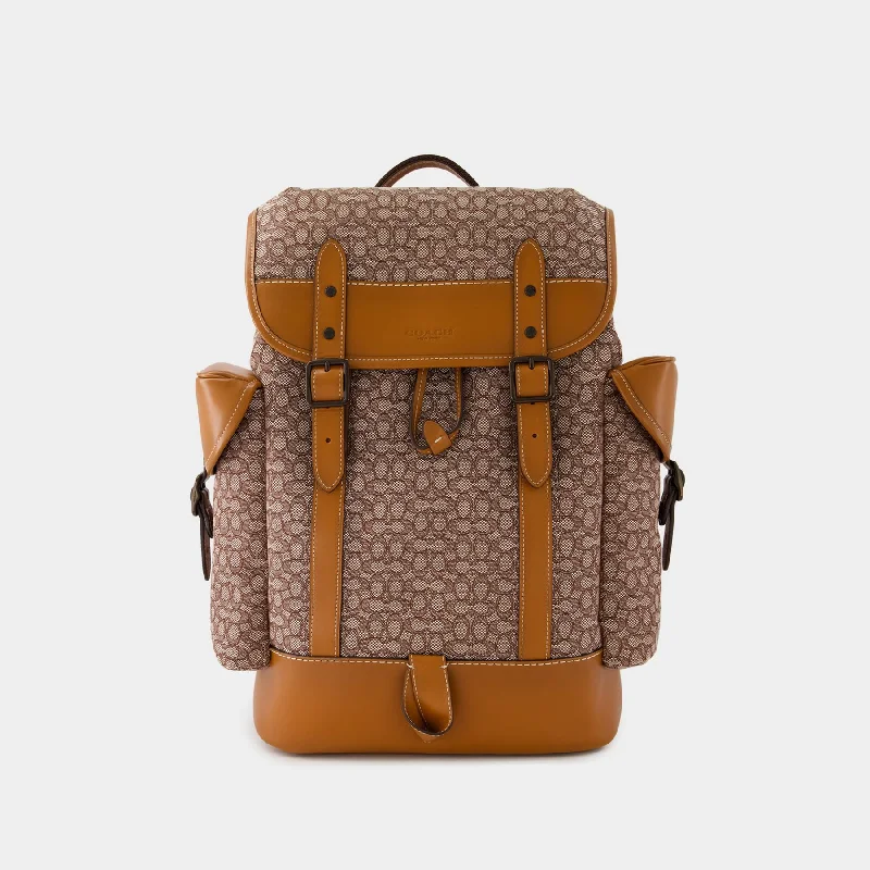 Coach Dempsey bags with a contrast - colored interior for visual interestHitch Backpack - Coach - Leather - Cocoa