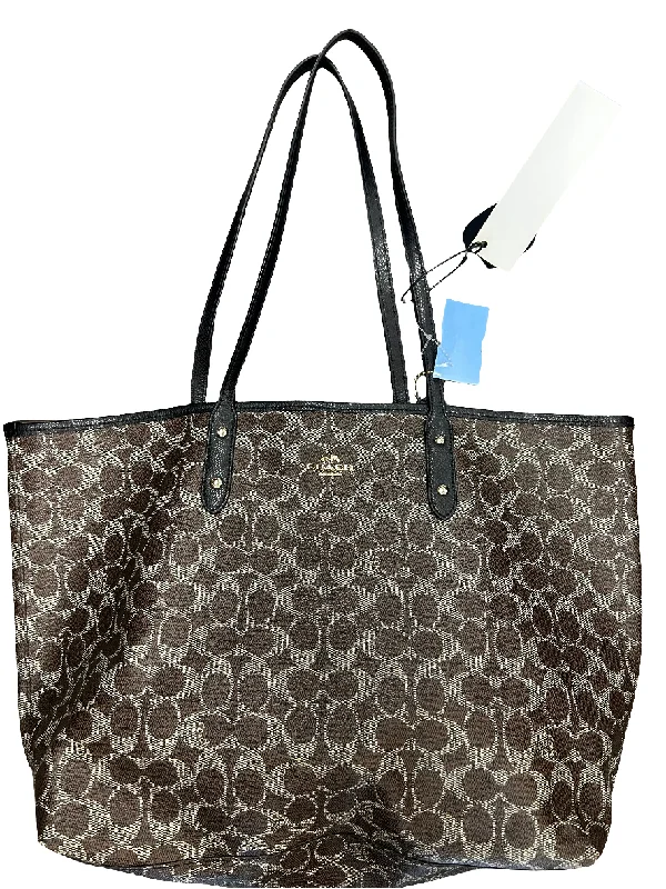 Coach tote bags with a snap - button closure and a decorative charm for styleHandbag Designer By Coach, Size: Large