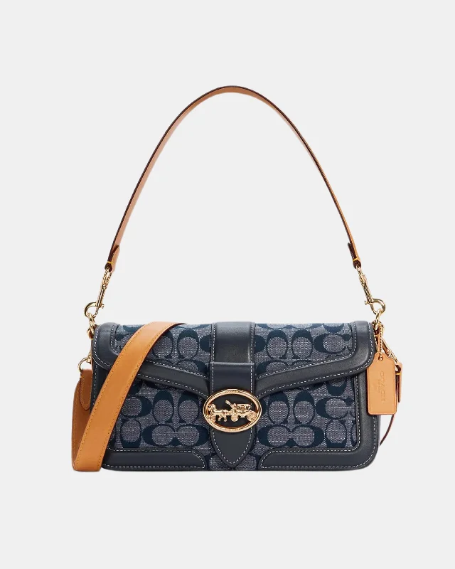 Coach Dempsey bags with a contrast - colored interior for visual interestCoach Georgie Shoulder Bag In Signature Chambray