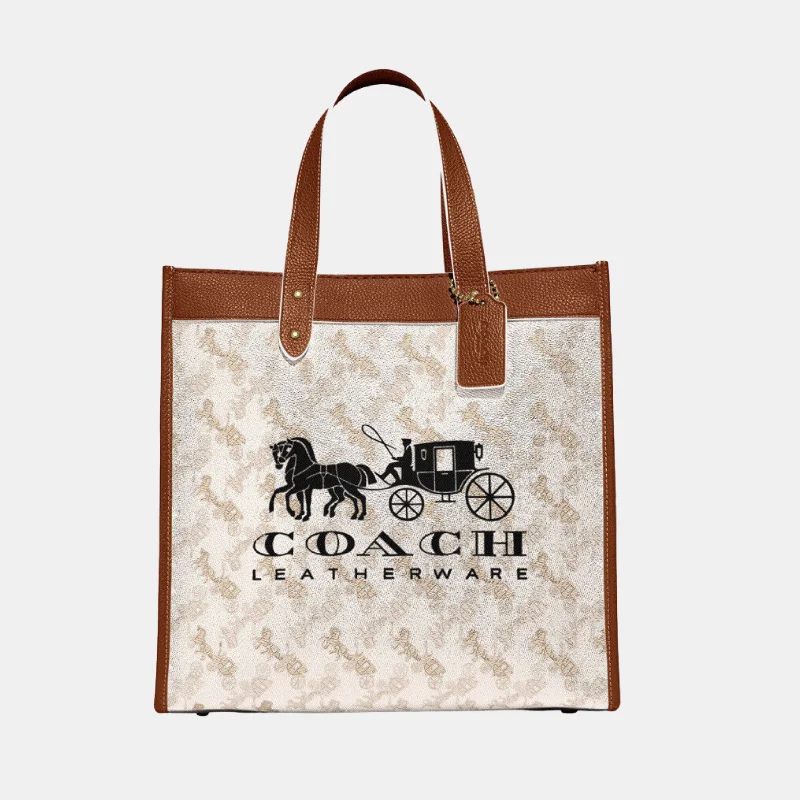 Ladies Coach shoulder bags with a tassel - decorated zipper for added charmcoach Field Tote With Horse And Carriage Print