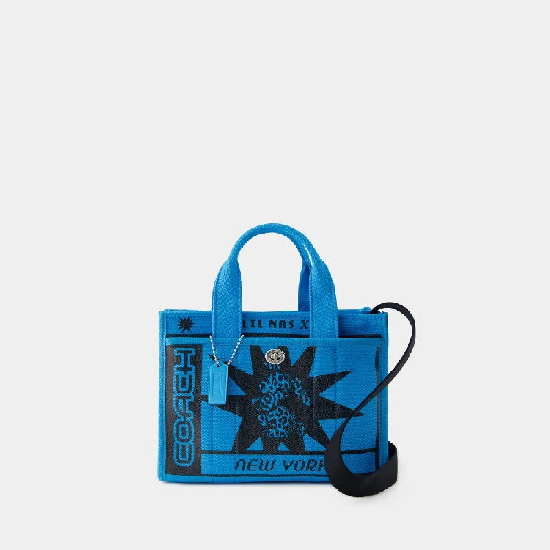 Coach backpacks with a padded laptop sleeve for travel and workLil Nas X Drop Cargo Tote 26 - Coach - Canvas - Blue