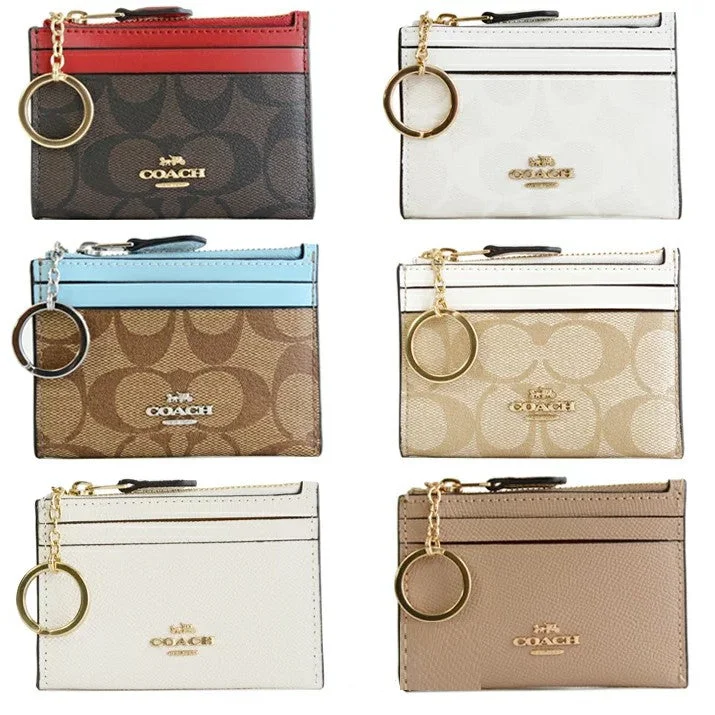 Coach handbags with a perforated leather detail for a breathable and unique designCOACH Mini Skinny ID Case Signature Canvas Ladies Coin Purse / Coin Case