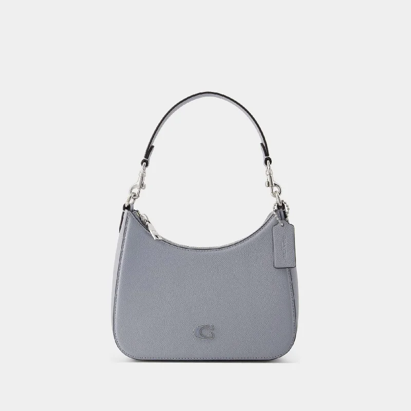 Coach tote bags with a snap - button closure and a decorative charm for styleCrossbody Hobo Bag - Coach - Leather - Grey Blue