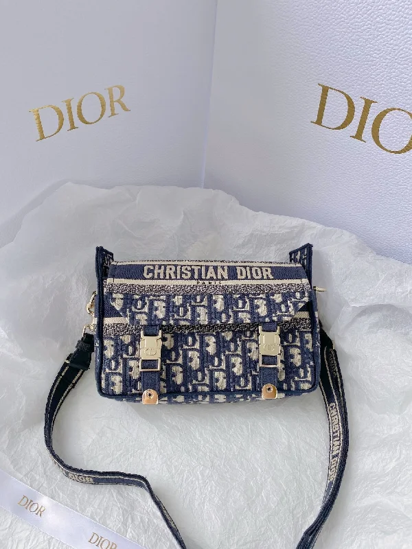 Christian Dior Saddle bags with a studded trim for a bold lookChristian Dior Small DYORCAMP Bag Blue Oblique Embroidery