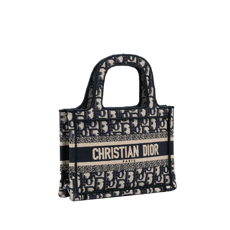 Christian Dior tote bags with a printed Dior logo on the frontDior Mini Oblique Book Tote (SHG-YeuBpR)